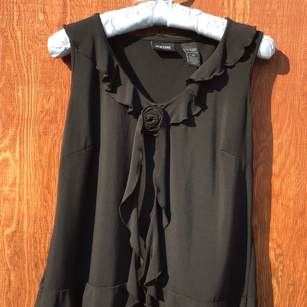 Sassy sleeveless, ruffle front top.